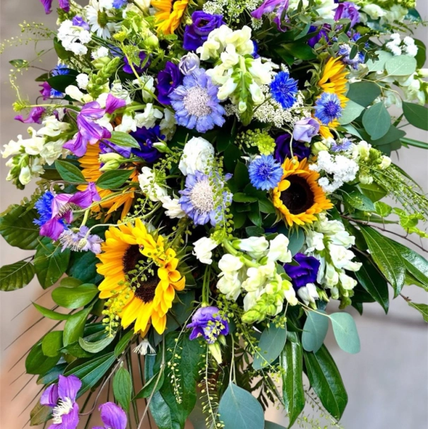 Meadow sunshine casket spray