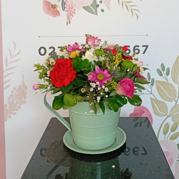 Florist choice tea cup arrangement