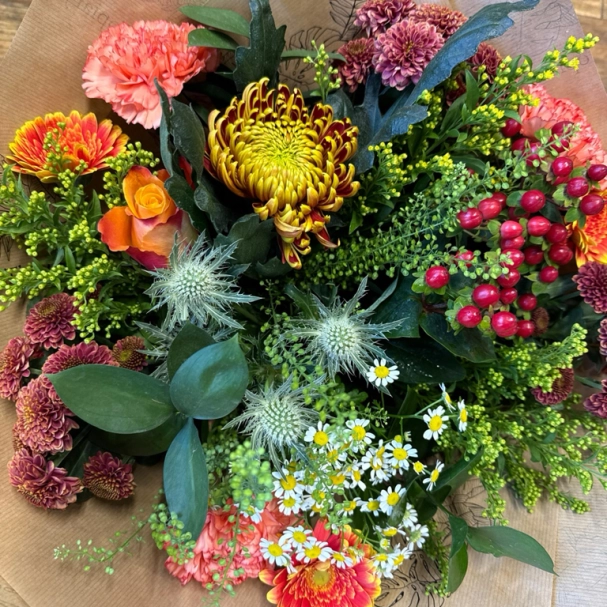 Autumnal hand tied bouquet in water