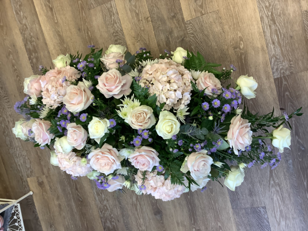 Seasonal pastel casket spray