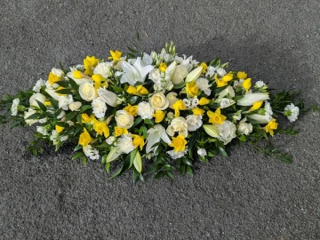 white-casket-with-daffs