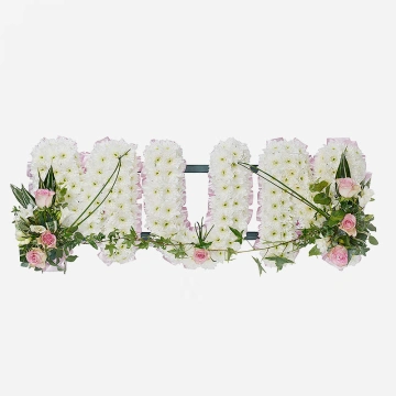 mum-funeral-tribute-in-white-chrysanthemum-letters-on-a-grey-background-1