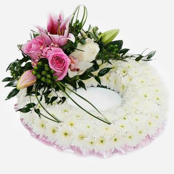 pink-massed-wreath-made-with-white-chrysanthemum-and-a-pink-rose-and-lily-feature-on-a-grey-background-1