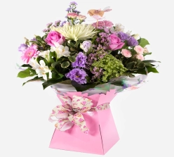 pink-gift-box-with-a-vibrant-arrangement-of-pink-purple-and-white-fresh-flowers-1