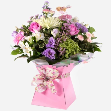 pink-gift-box-with-a-vibrant-arrangement-of-pink-purple-and-white-fresh-flowers-1