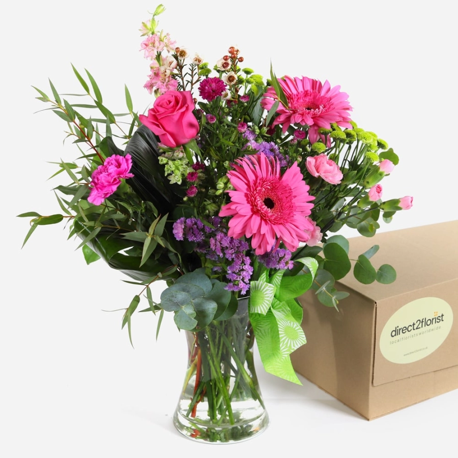 pink-roses-gerberas-and-carnations-in-a-vase-with-a-green-ribbon-1