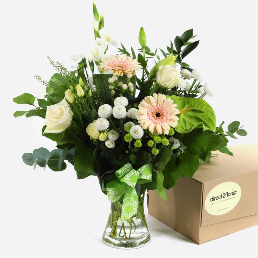 pastel-roses-and-gerberas-in-a-vase-with-a-ribbon-1
