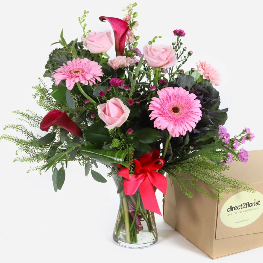 pink-roses-gerberas-and-calla-lilies-in-a-vase-with-a-red-ribbon-1