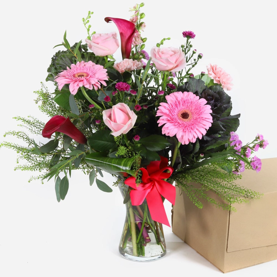 French riviera-pink roses gerberas and calla lilies in a vase with a red ribbon pink roses gerberas and calla lilies in a vase with a red ribbon 2