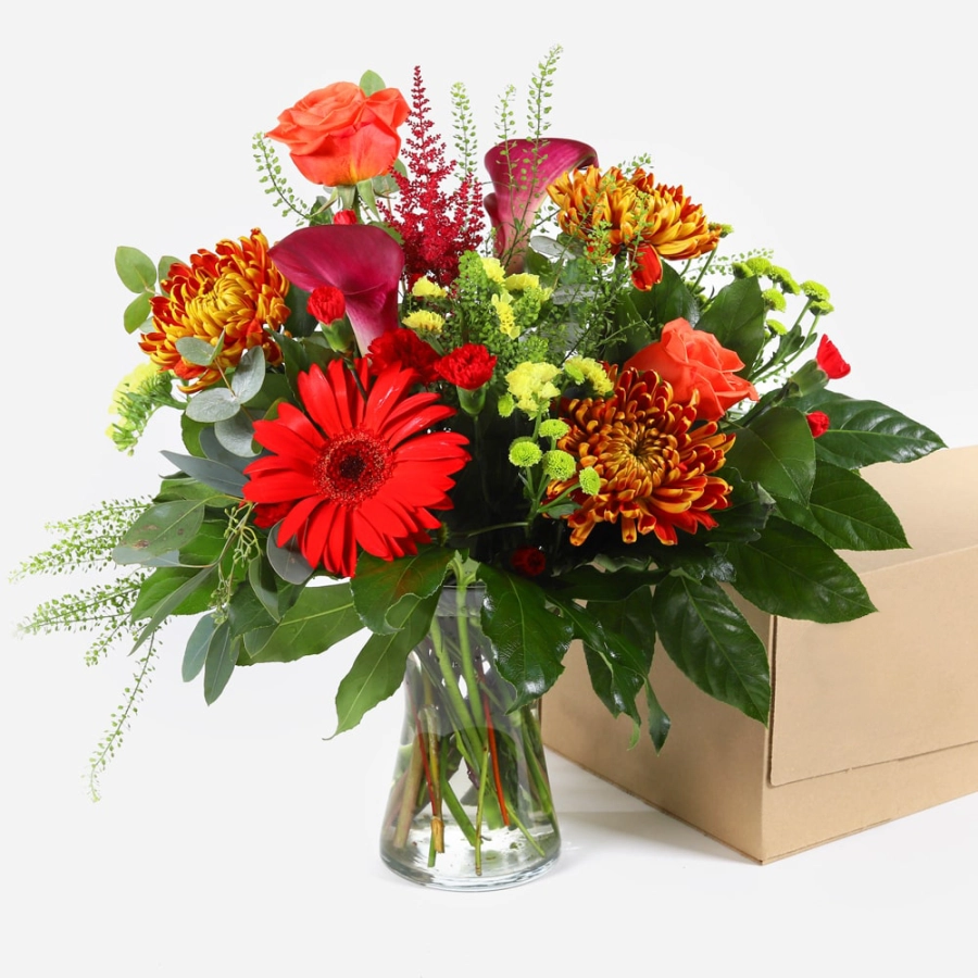 Fiery horizon bouquet with red gerberas orange roses and seasonal flowers in kraft wrap beside direct2florist delivery box fiery horizon bouquet with red gerberas orange roses and seasonal flowers in kraft wrap beside direct2florist delivery box 2