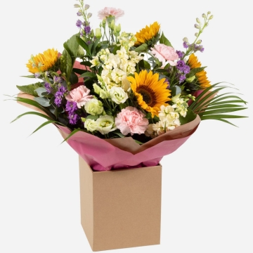 bright-and-cheerful-flower-bouquet-with-sunflowers-pink-carnations-white-lisianthus-and-purple-blooms-presented-in-a-kraft-gift-box-1