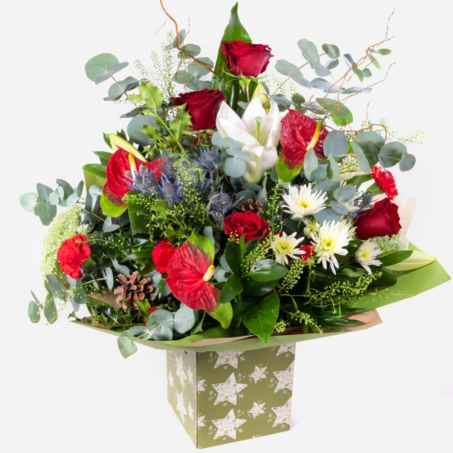 Luxury christmas bouquet in a festive star-patterned gift box