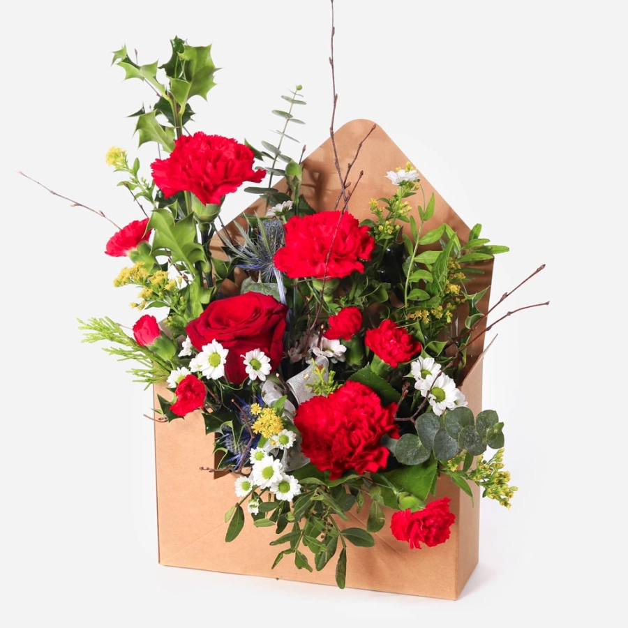 Christmas arrangement presented in a festive letterbox-style gift box